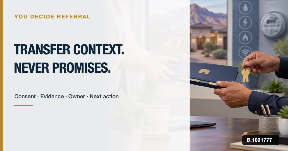 Two real-estate professionals passing a slim home-operations folder and key across a private office desk.